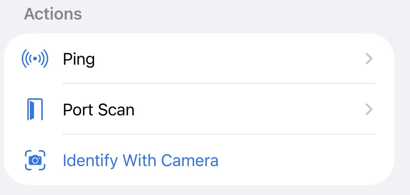 The Actions section of a device in PingKit for iPhone, offering Ping, Port Scan and Identify With Camera, which reads the make and model off the device's own printed label.